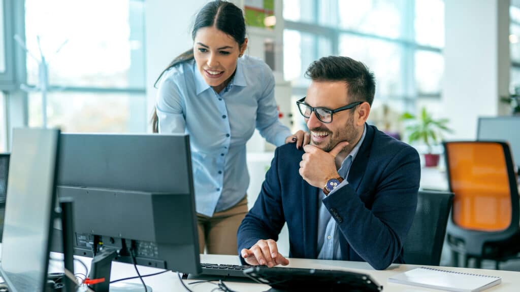 Discussing online project with employee in the office